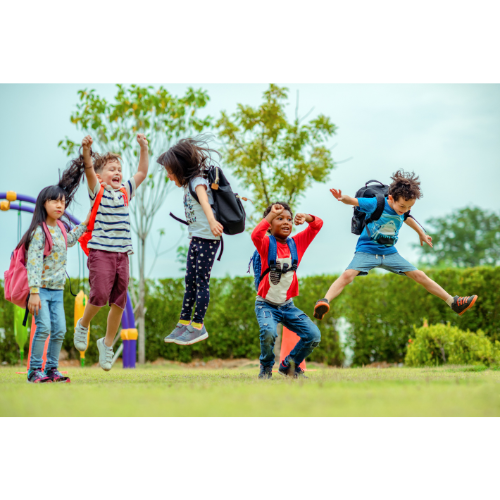Children jumping joyfully outdoors
